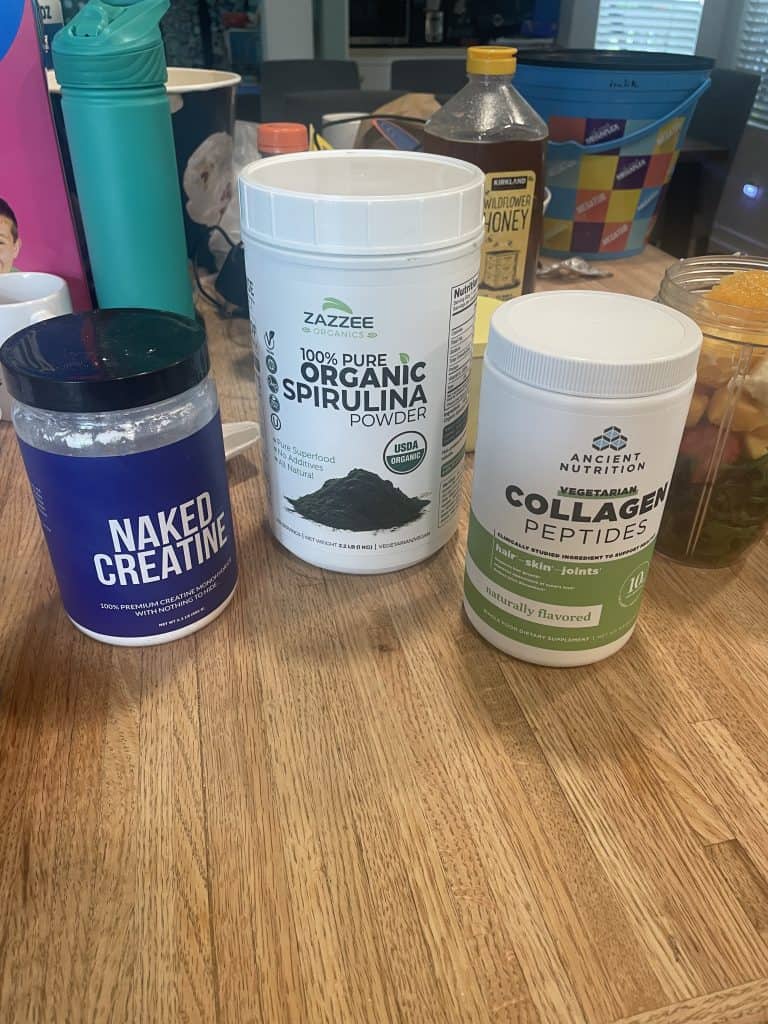a group of supplements containers on a table