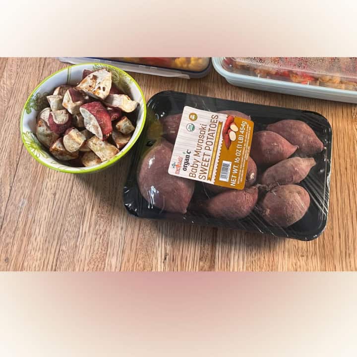 Two set of Japanese white sweet potatoes one raw and another one roasted and seasoned in a small green bowl