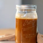 Creamy, golden brow vegan gravy in a glass jar