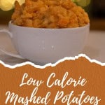 Creamy mashed potatoes in a white bowl with festive blurred lights background.