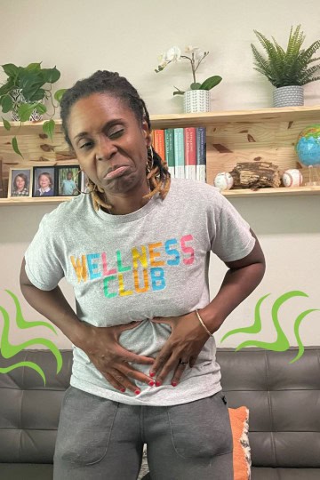 Malika Sani experiencing stomach pain and discomfort