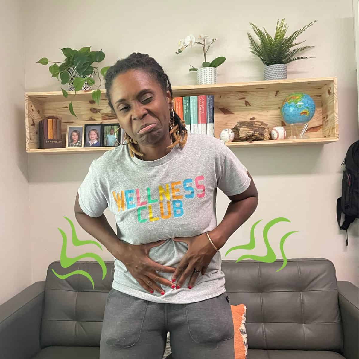 Malika Sani experiencing stomach pain and discomfort