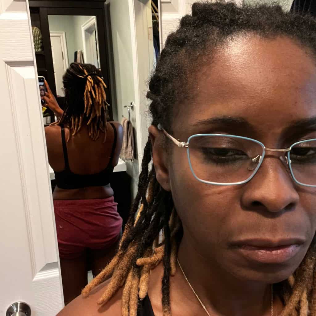 Dreadlocks hairstyle, woman wearing glasses, mirror selfie, natural hair, African American hair.