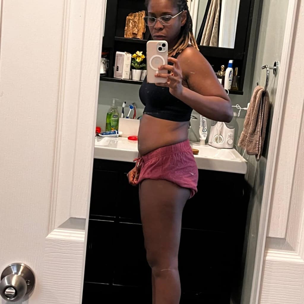 Comfortable casual outfit for women, mirror selfie in bathroom showing confident posture.